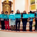 people holding signs