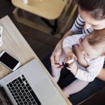 Mother with baby and laptop